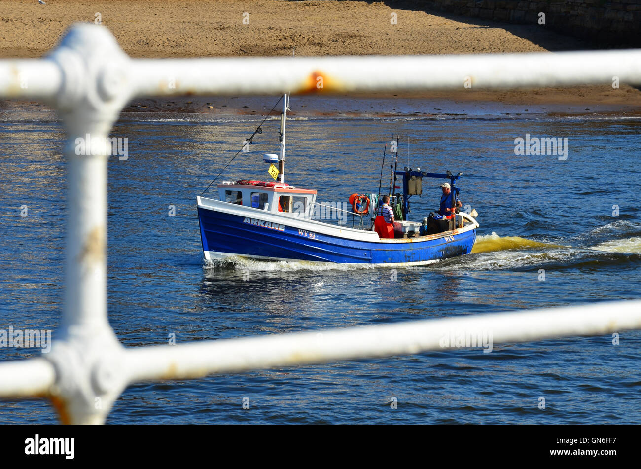 Boat leaving Whitby harbour North Yorkshire England UK Stock Photo - Alamy
