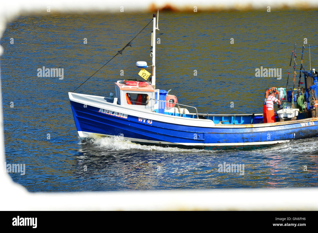 Boat leaving Whitby harbour North Yorkshire England UK Stock Photo - Alamy