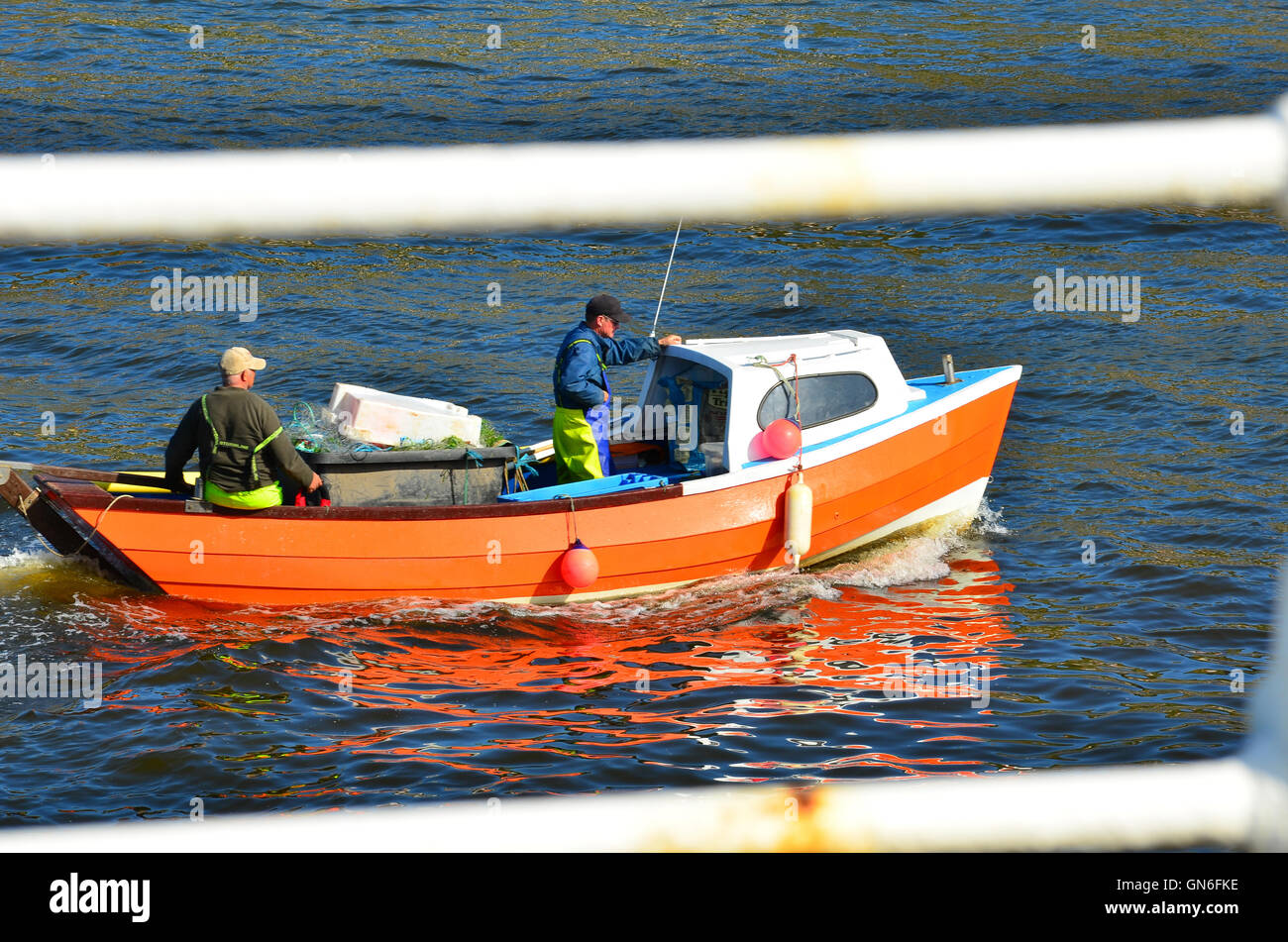 Boat entering Whitby harbour North Yorkshire England UK Stock Photo - Alamy