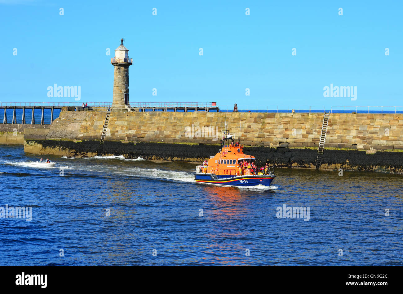 RNLI Life Boat entering Whitby harbour North Yorkshire England UK Stock ...