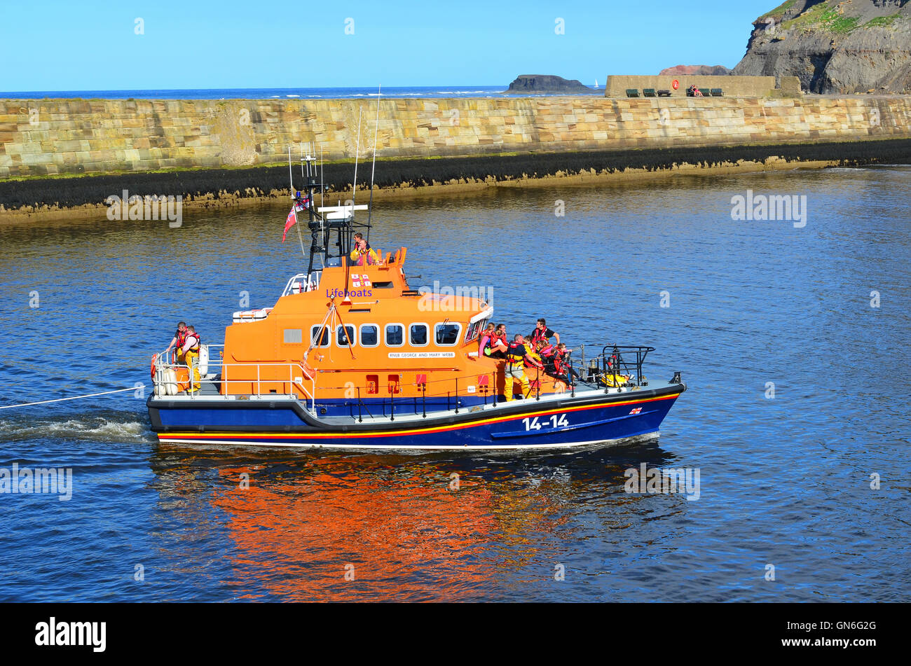 RNLI Life Boat entering Whitby harbour North Yorkshire England UK Stock ...
