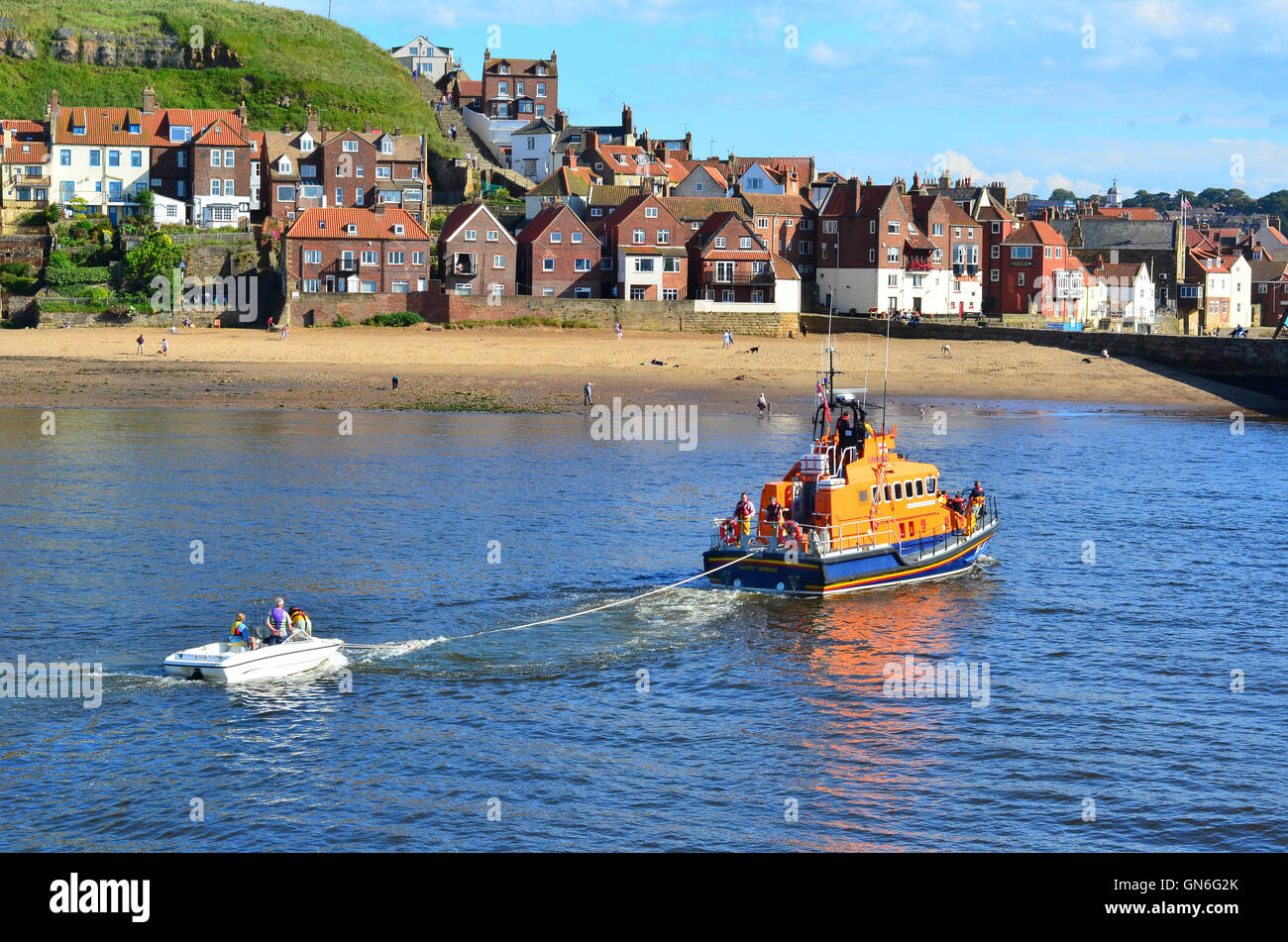 RNLI Life Boat entering Whitby harbour North Yorkshire England UK Stock ...