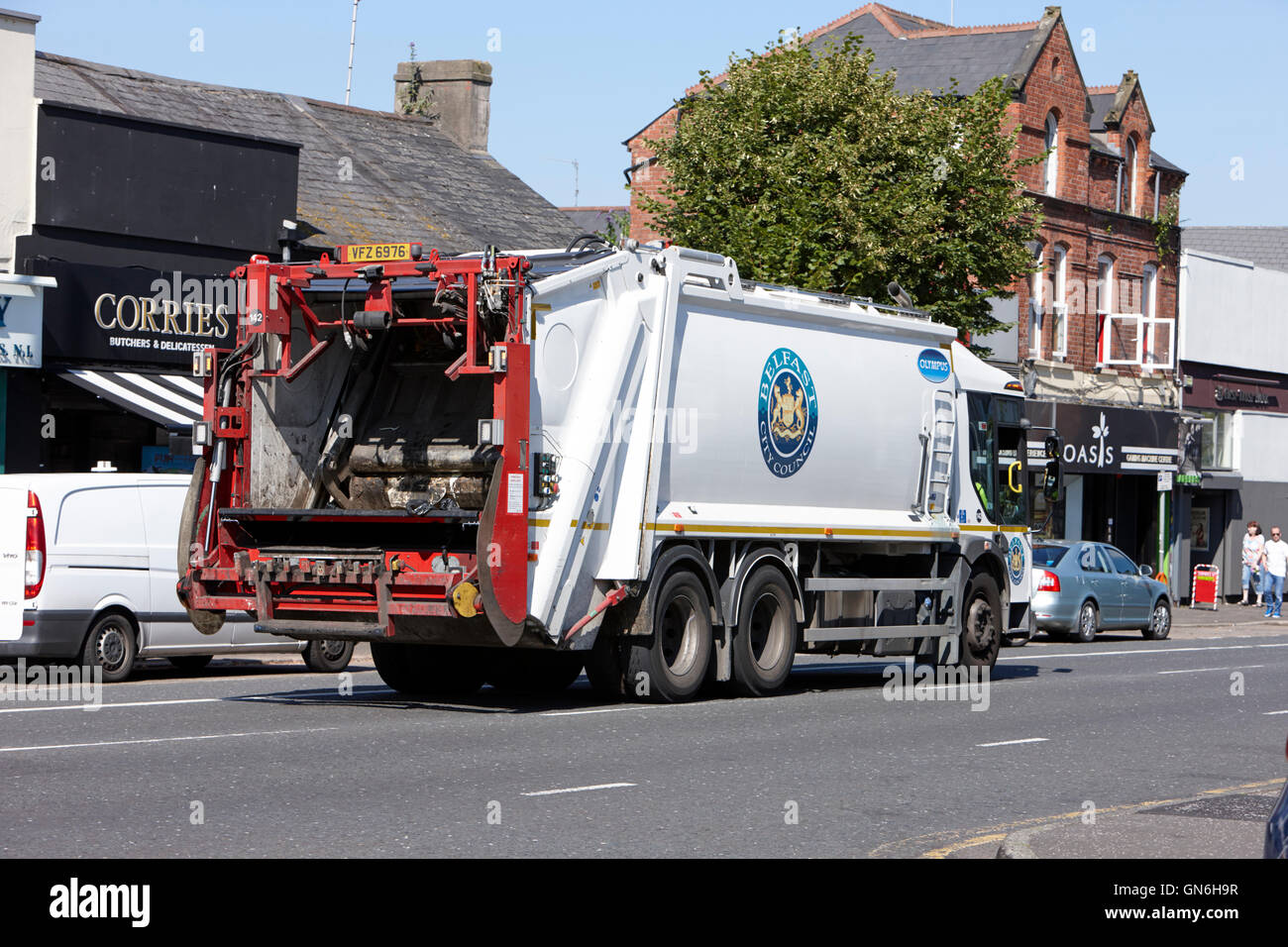 belfast city council refuse truck dennis olympus driving along road Stock Photo