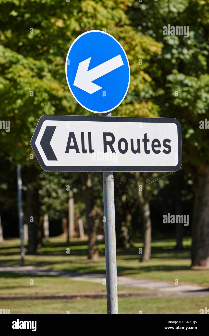 blue traffic direction arrow with all routes sign in the uk Stock Photo