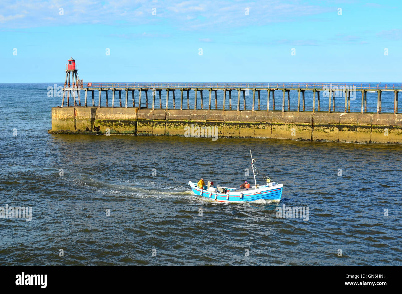 Boat entering Whitby harbour North Yorkshire England UK Stock Photo - Alamy