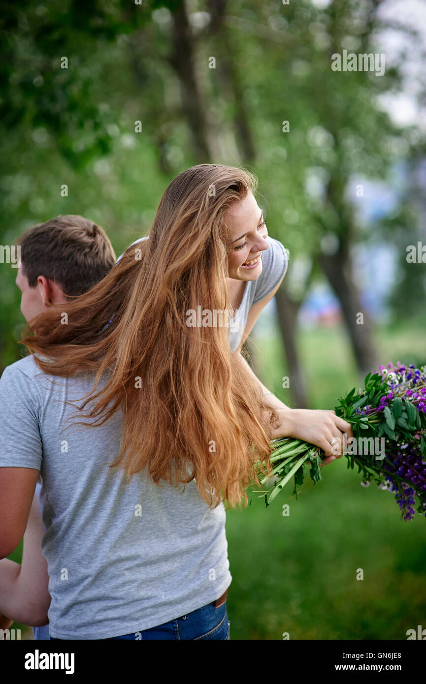 young couple in love walking on the summer park Stock Photo