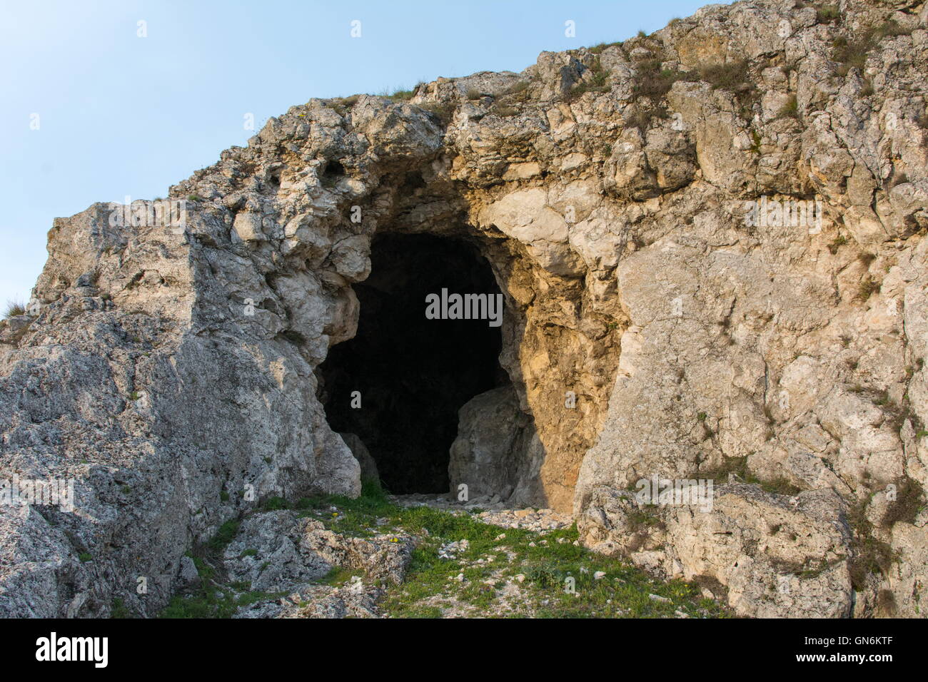 View at the natural cave entrance at the mountain Stock Photo
