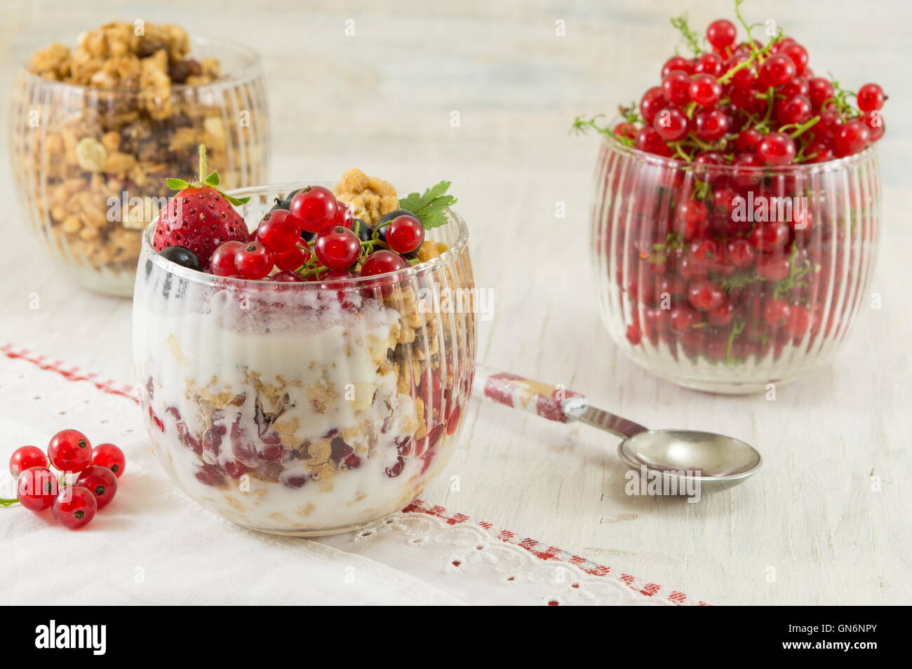 Granola parfait with berry fruit and cream. Healthy dessert Stock Photo