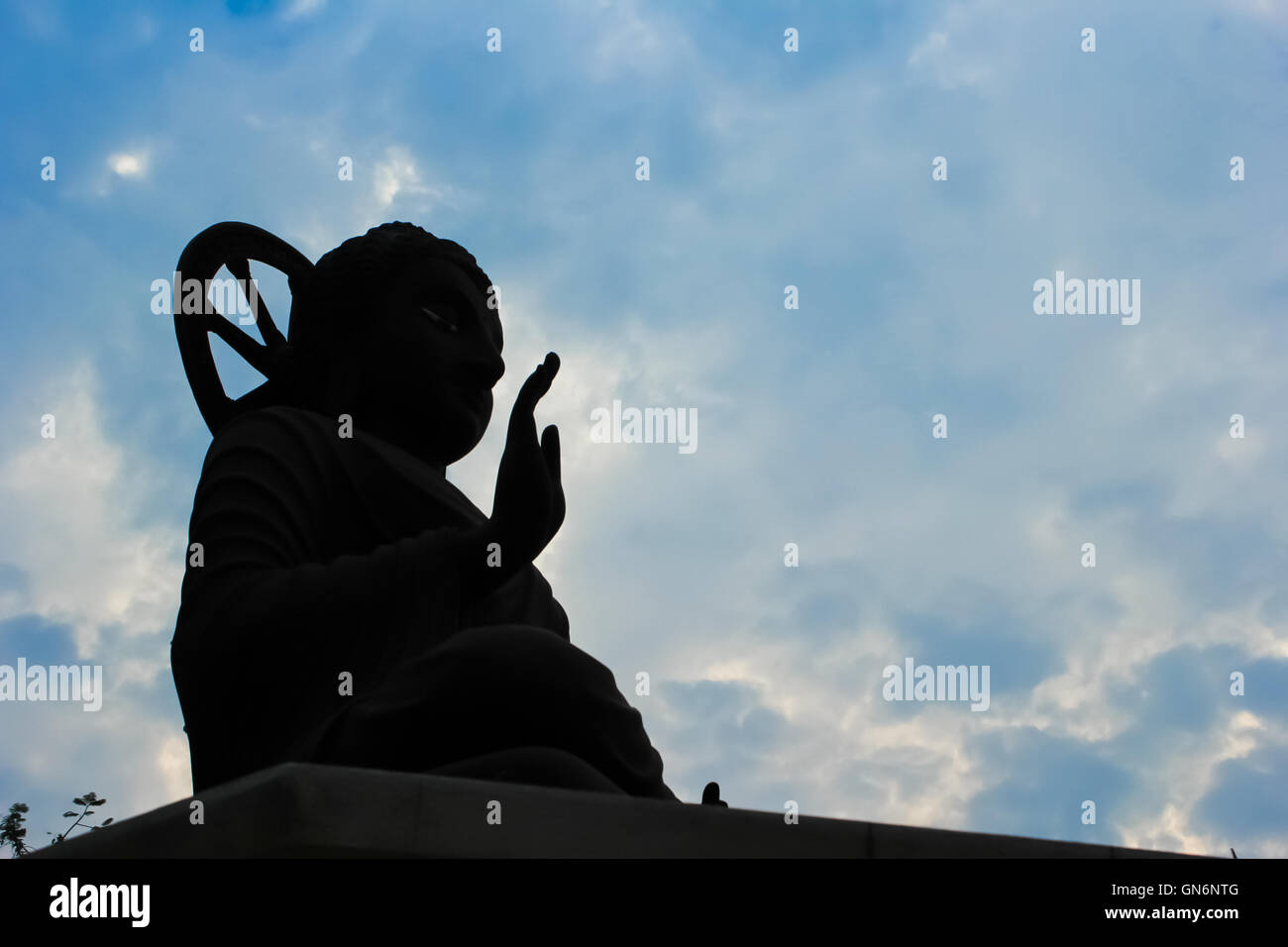 the peaceful Buddha statue in Thai temple Stock Photo