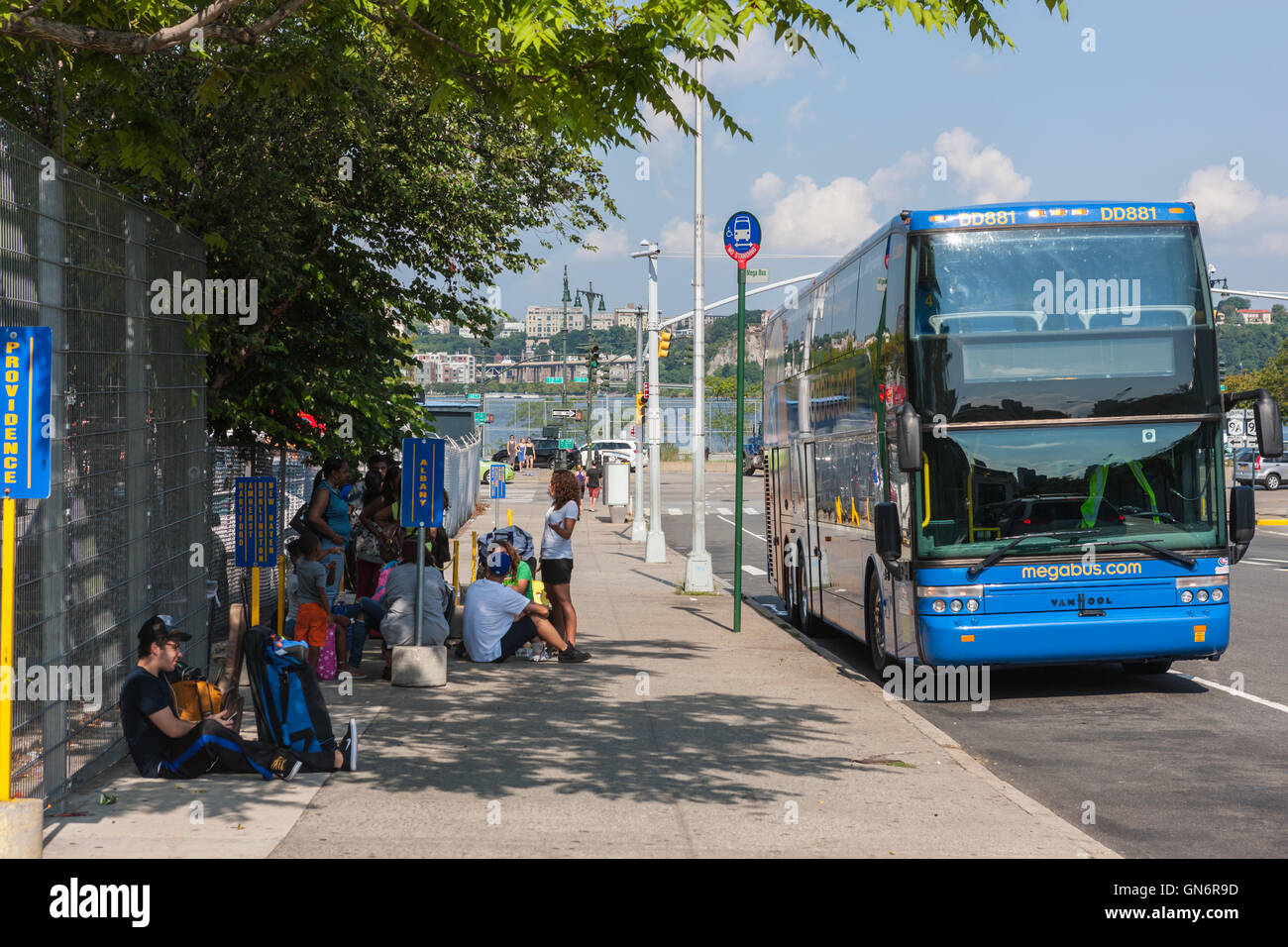 People wait to board a discount Megabus bound for Albany, New York at a