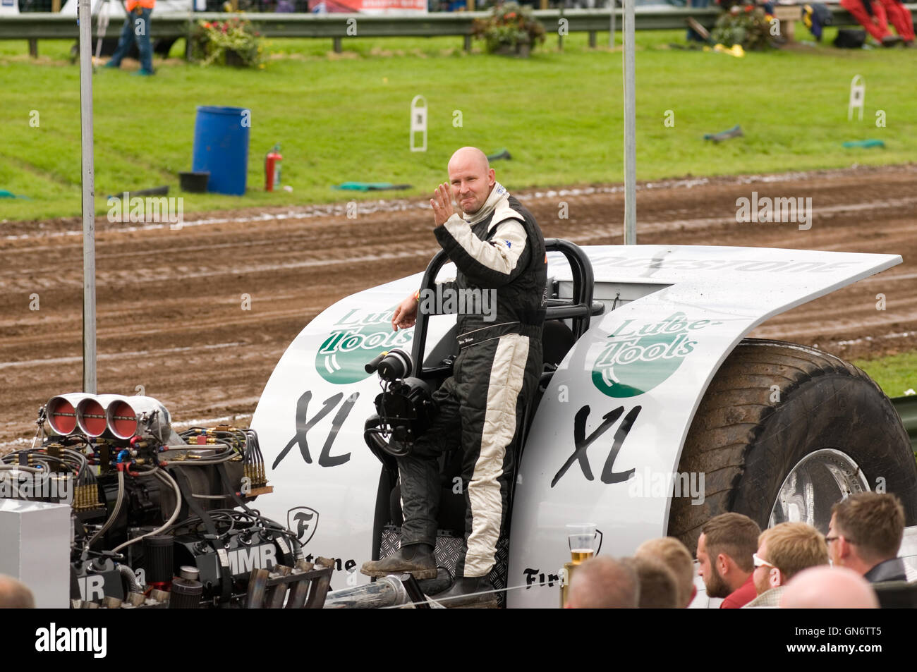 a happy tractor puller after successfully competing in a tractor pull Stock Photo