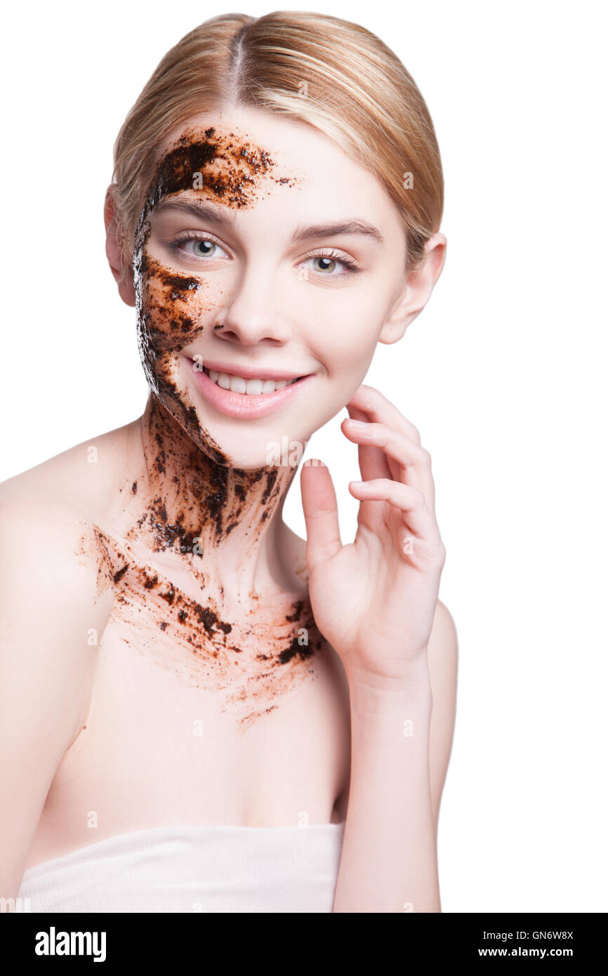 Peeling face with coffee scrub,Beautiful Young Woman Facial treatment skin cleansing and peeling. exfoliation of old skin cells, rejuvenation. Stock Photo
