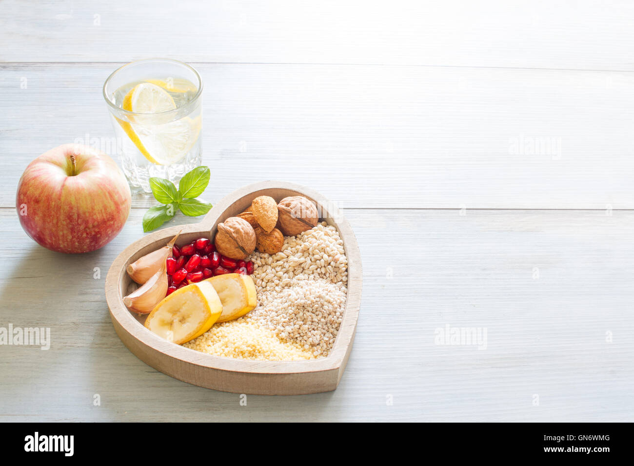 Healthy food in heart and water diet sport lifestyle concept Stock Photo