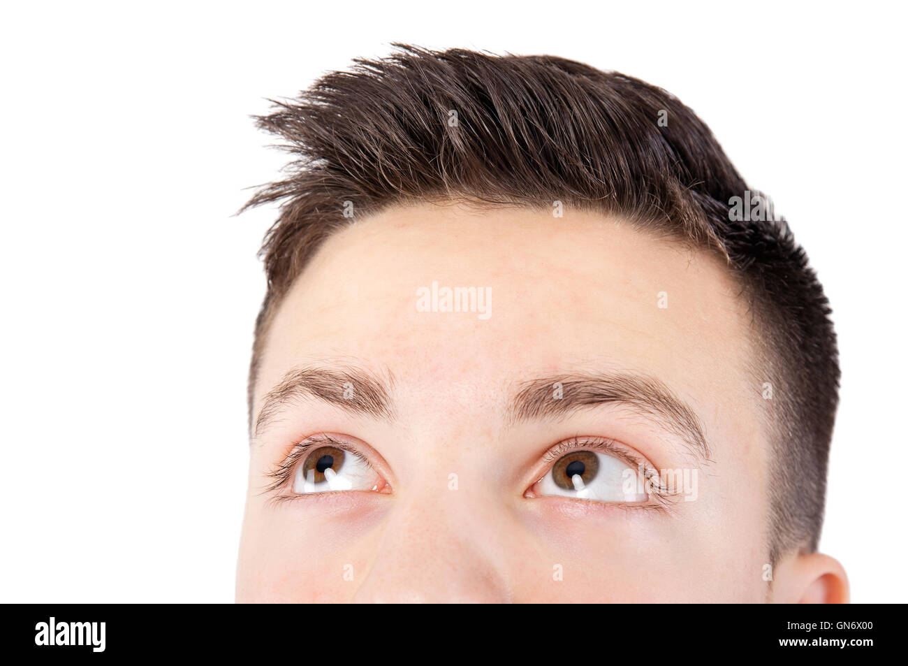 attractive teenage boy face looking up Stock Photo