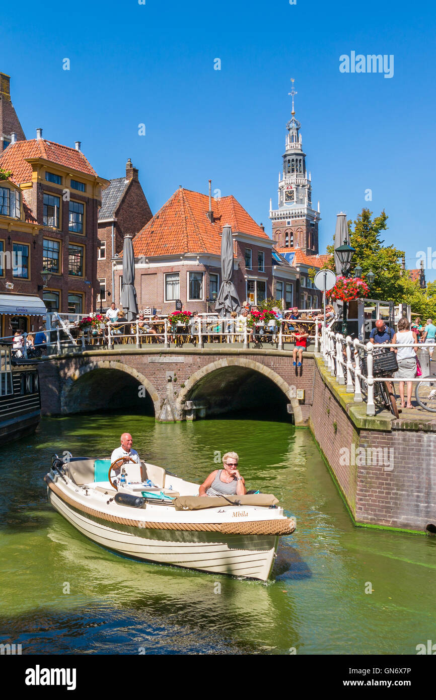 People on boat, bridge over Mient canal and weigh house tower in Alkmaar,  Netherlands Stock Photo