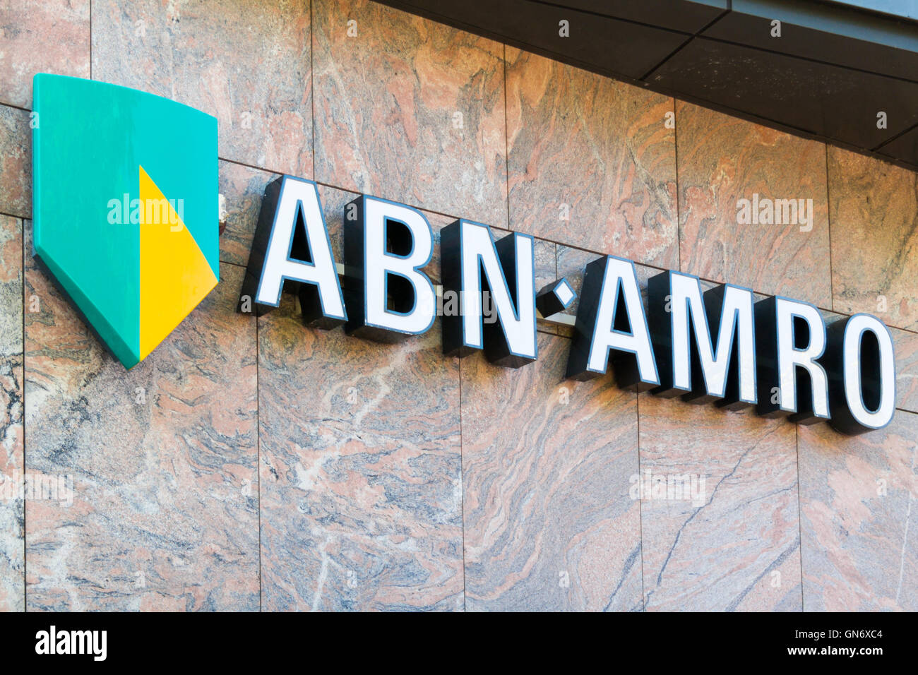 Brand name logo ABN AMRO bank on local branch office in Alkmaar Stock ...