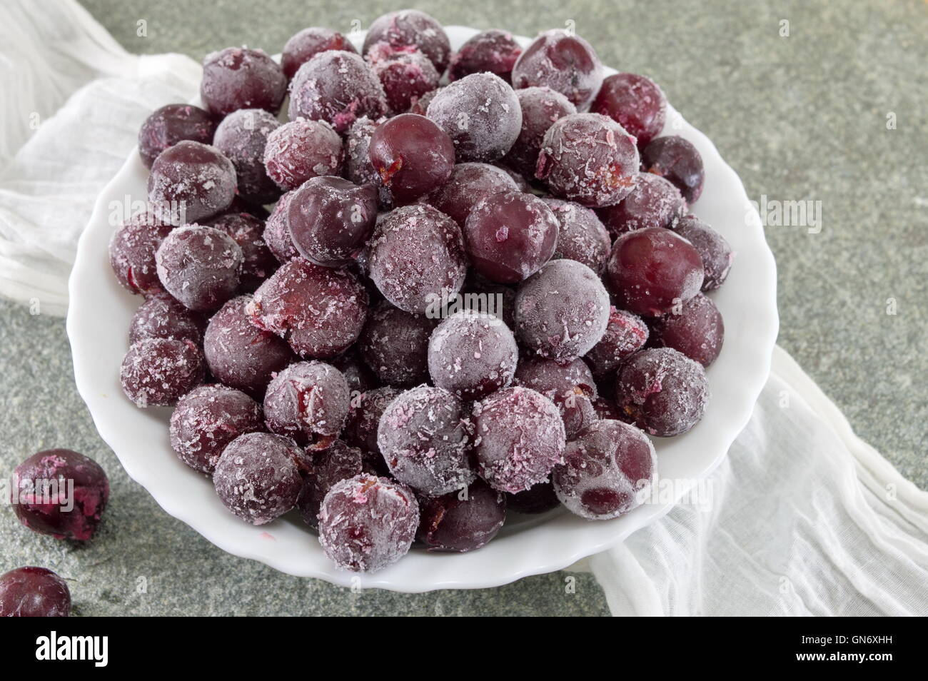 Frozen grapes served in a white bowl Stock Photo