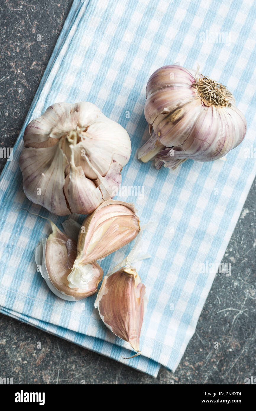 The fresh garlic on checkered napkin. Stock Photo
