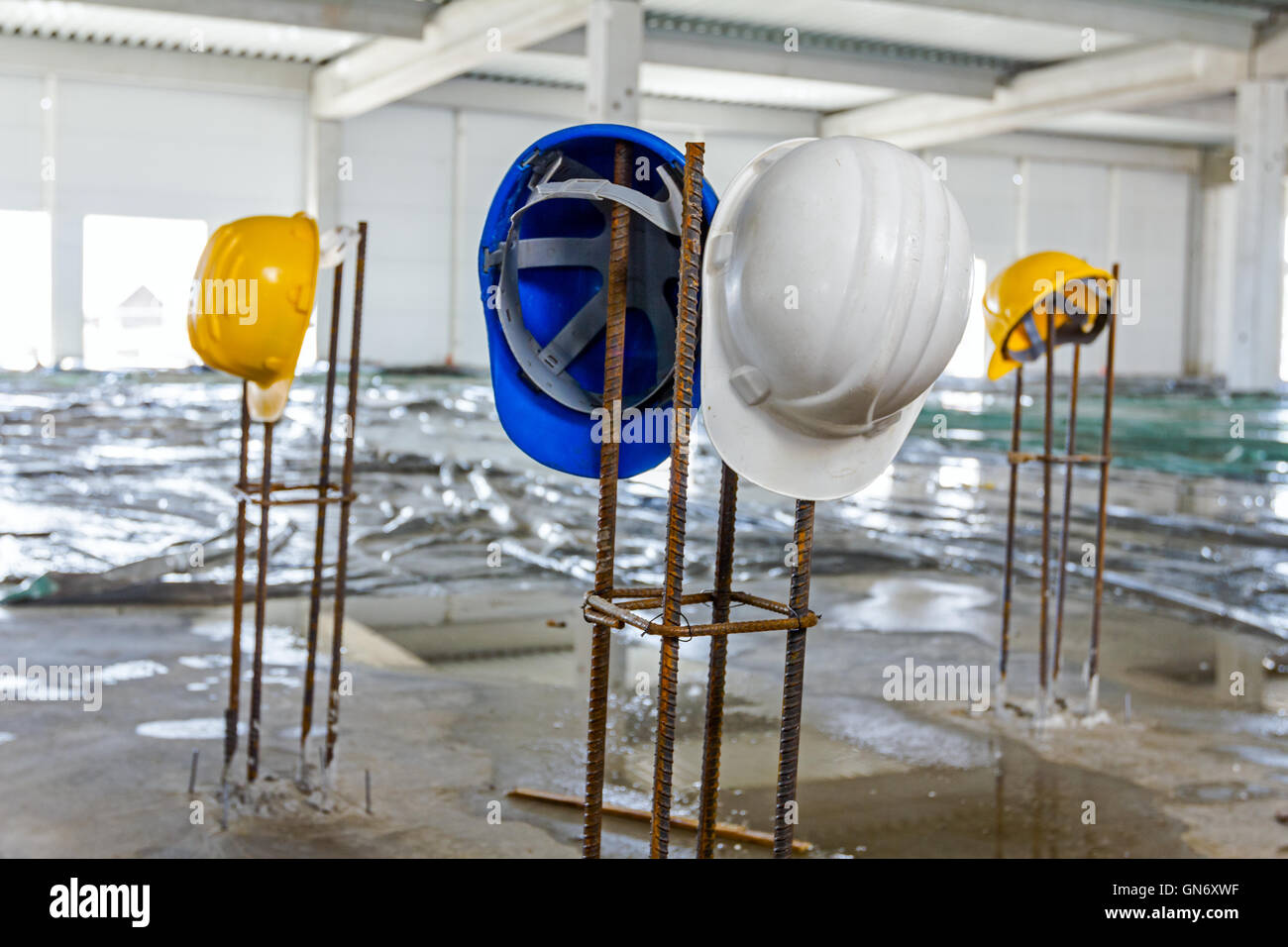 Safety equipment placed on the tied reinforcing basic metal profile in square shape Stock Photo