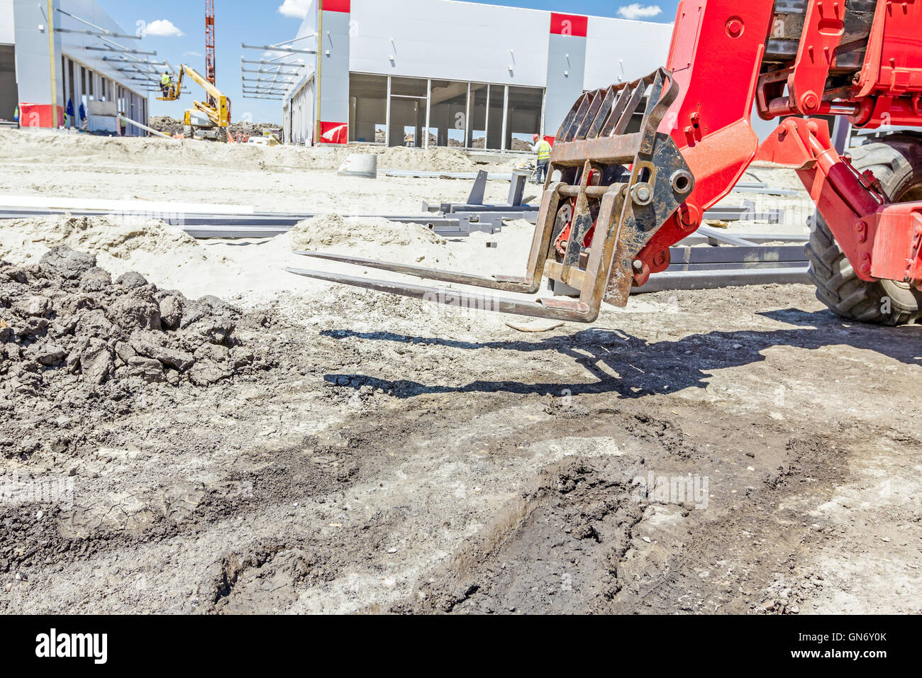 Logistics concept, close up view on telescopic forklift at construction site. Stock Photo