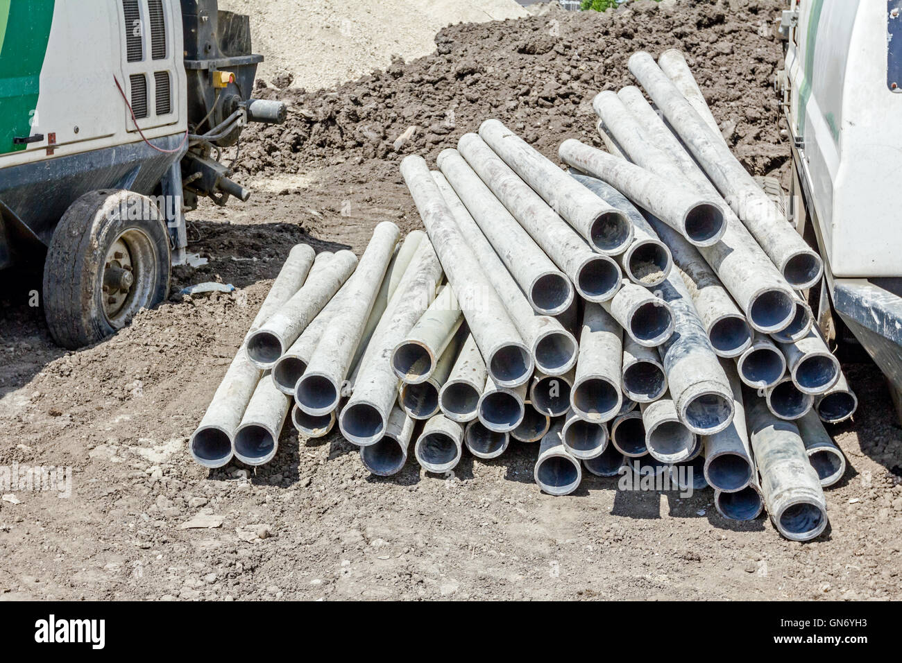 Pile of used pipes for drilling water wells waiting to drill into deep ground Stock Photo Alamy