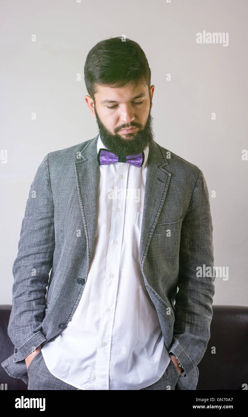 Fashionable man in a suit with a bow tie Stock Photo