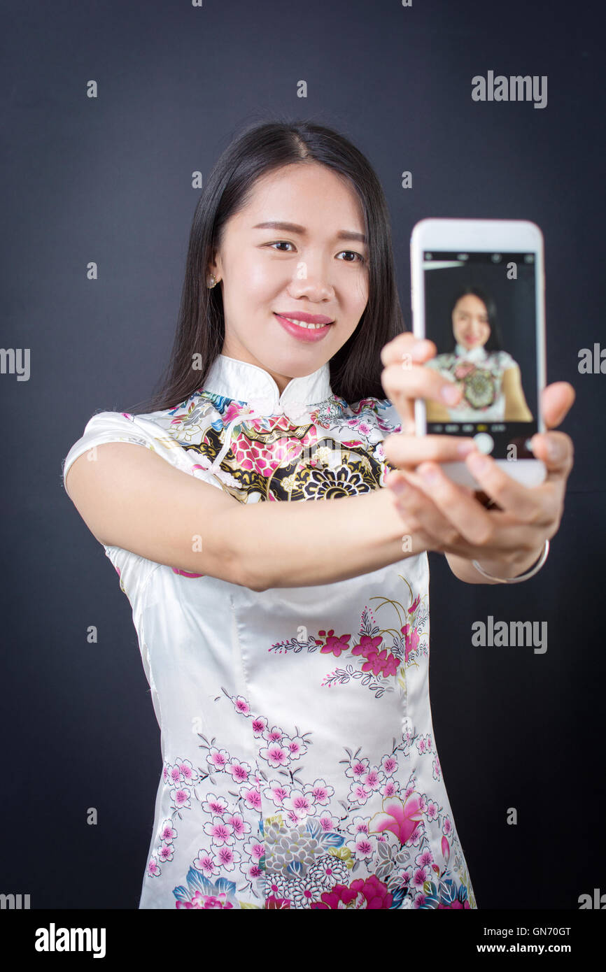 Young woman making a selfie with smart phone device Stock Photo