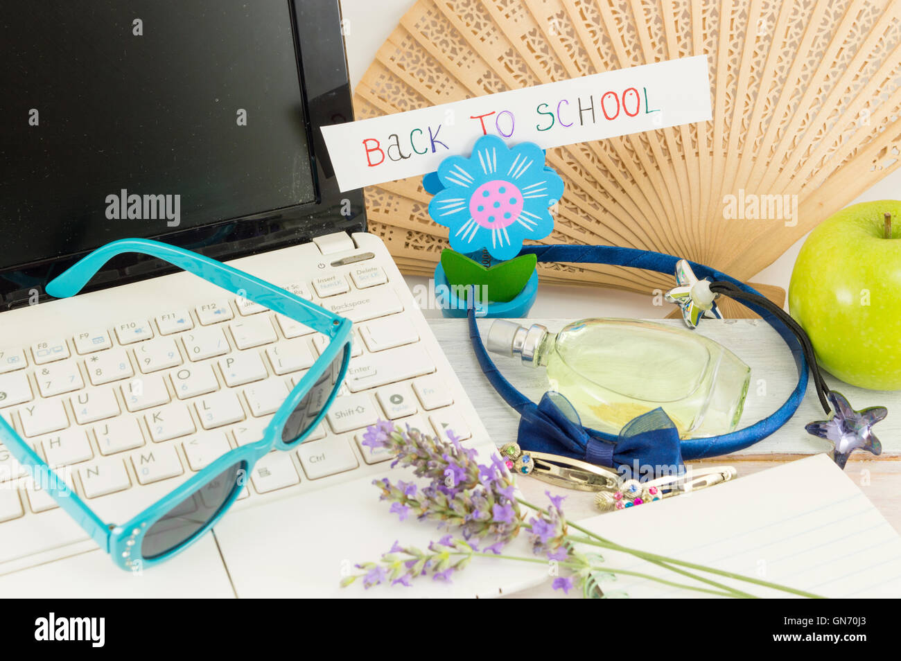 Back to school, laptop and bunch of girl accessories Stock Photo