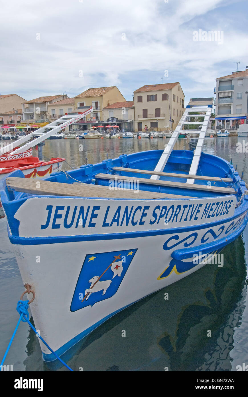 Blue and white joust boat in the harbour at Meze in the Herault department. Stock Photo