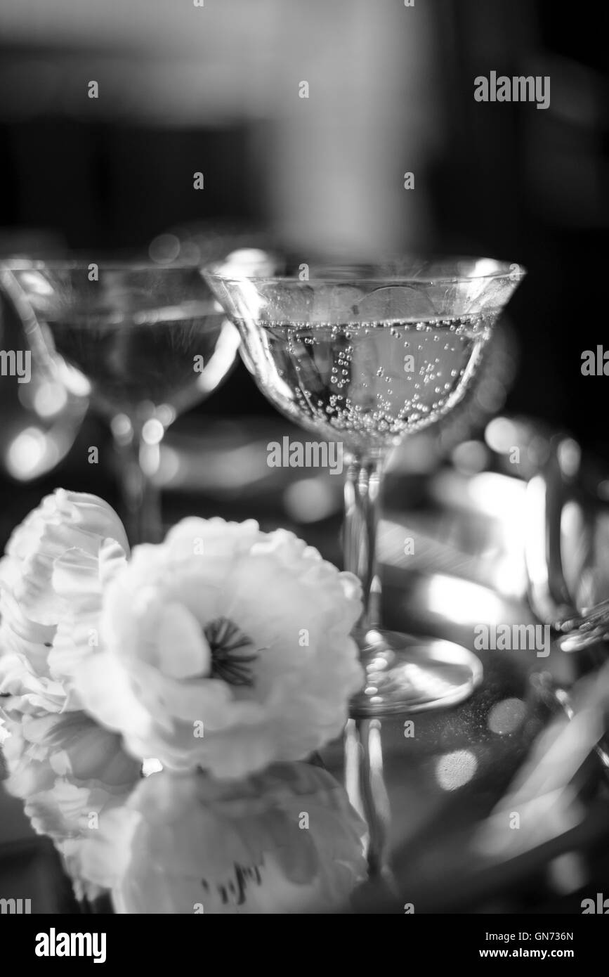 Black and White of a glasses of champagne on a silver tray Stock Photo
