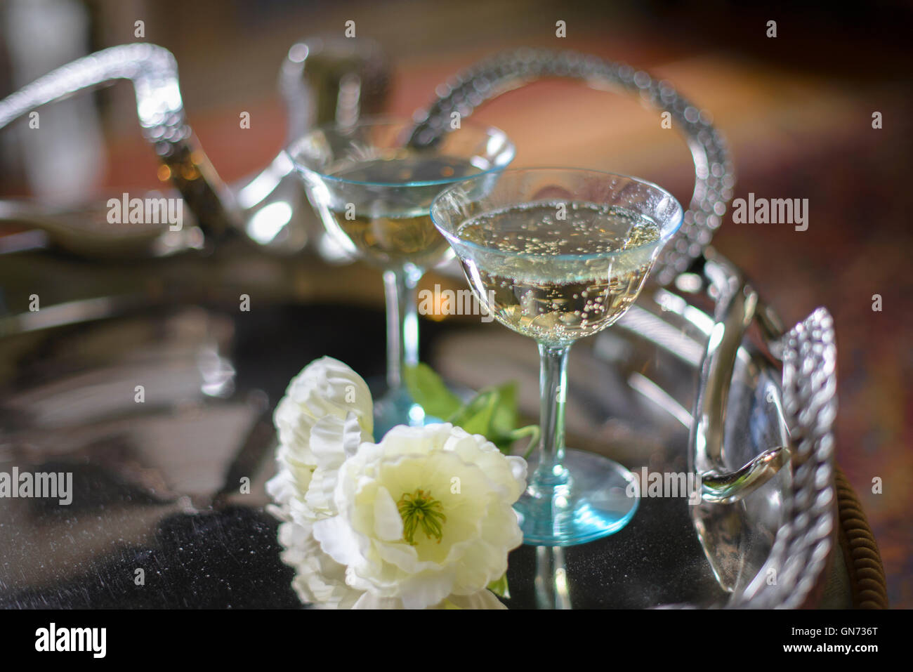 Champagne glasses on a silver serving tray Stock Photo Alamy