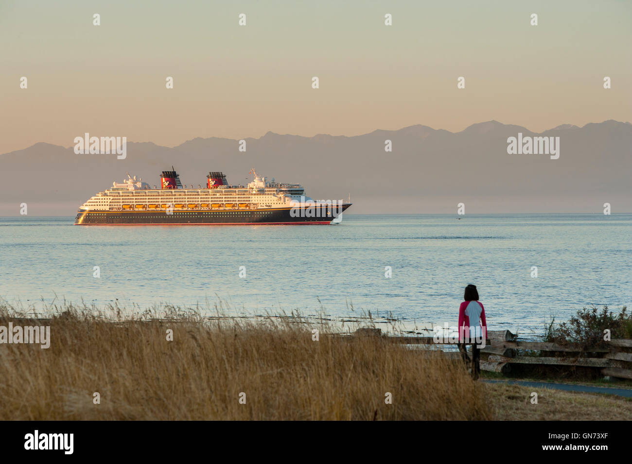 Cruise ship Disney Wonder in Salish Sea at dawn-Victoria, British Columbia, Canada. Stock Photo