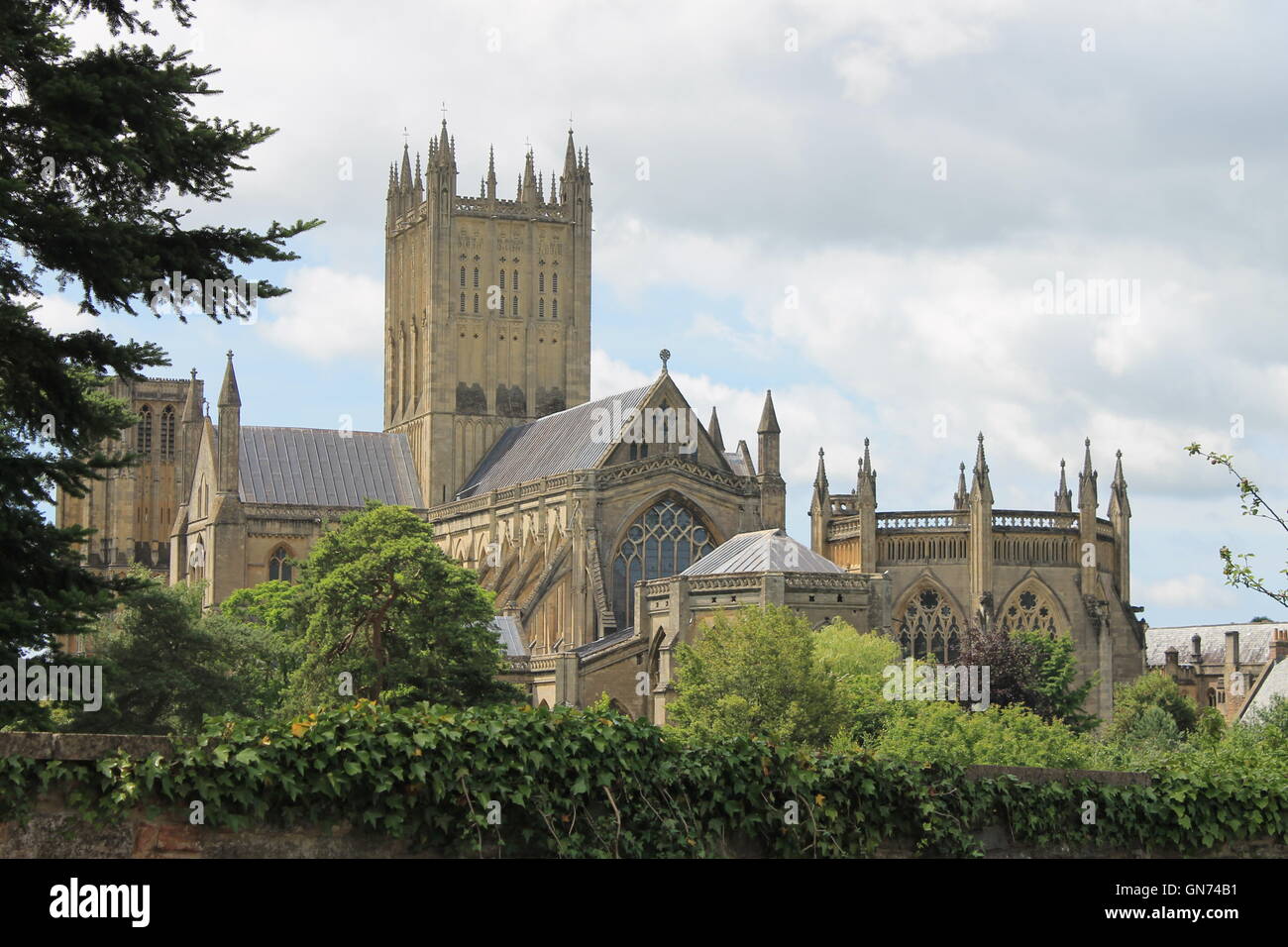 Wells Cathedral, east elevation, showing the main central tower, nave and Chapter House viewed from Tor Street, Wells, Somerset Stock Photo