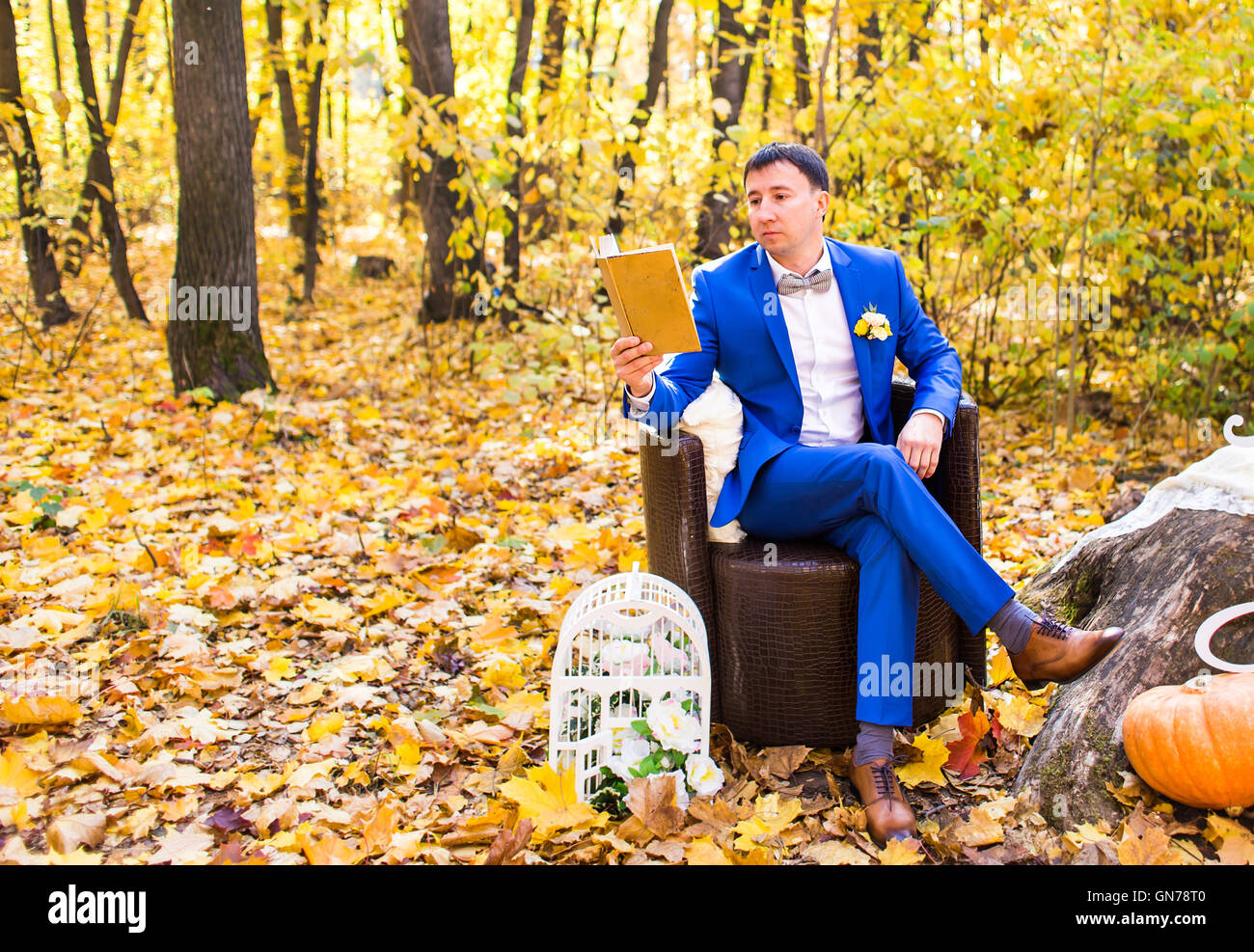 Seated man pointing book hi-res stock photography and images - Alamy