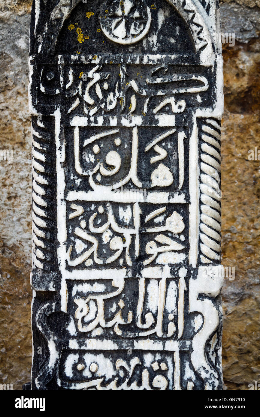 Arabic letters inscription on a tombstone from Isa Bey Mosque in Selcuk Town, Turkey Stock Photo