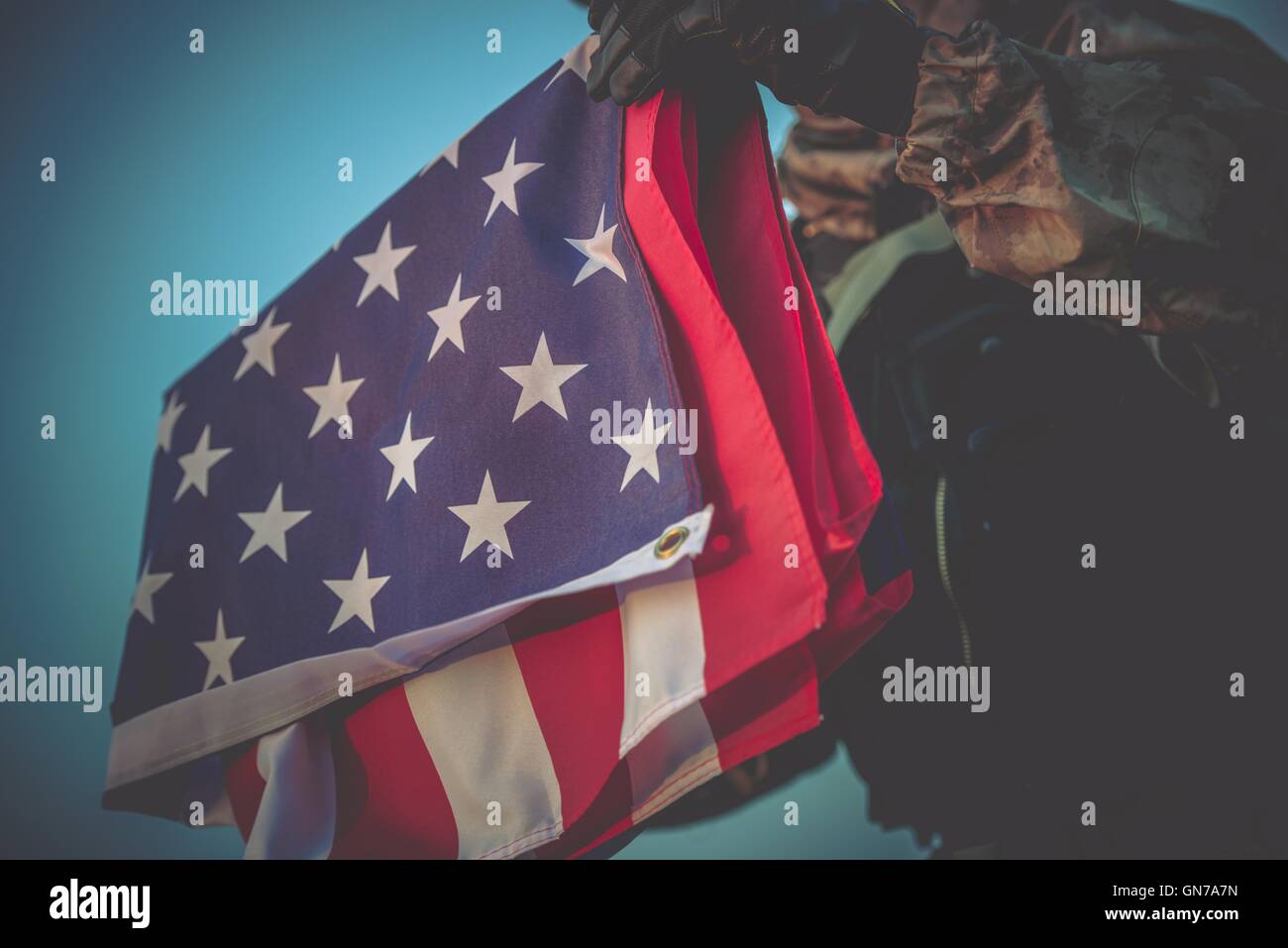 Folded American Flag in Soldier Hands Closeup Photo Stock Photo - Alamy