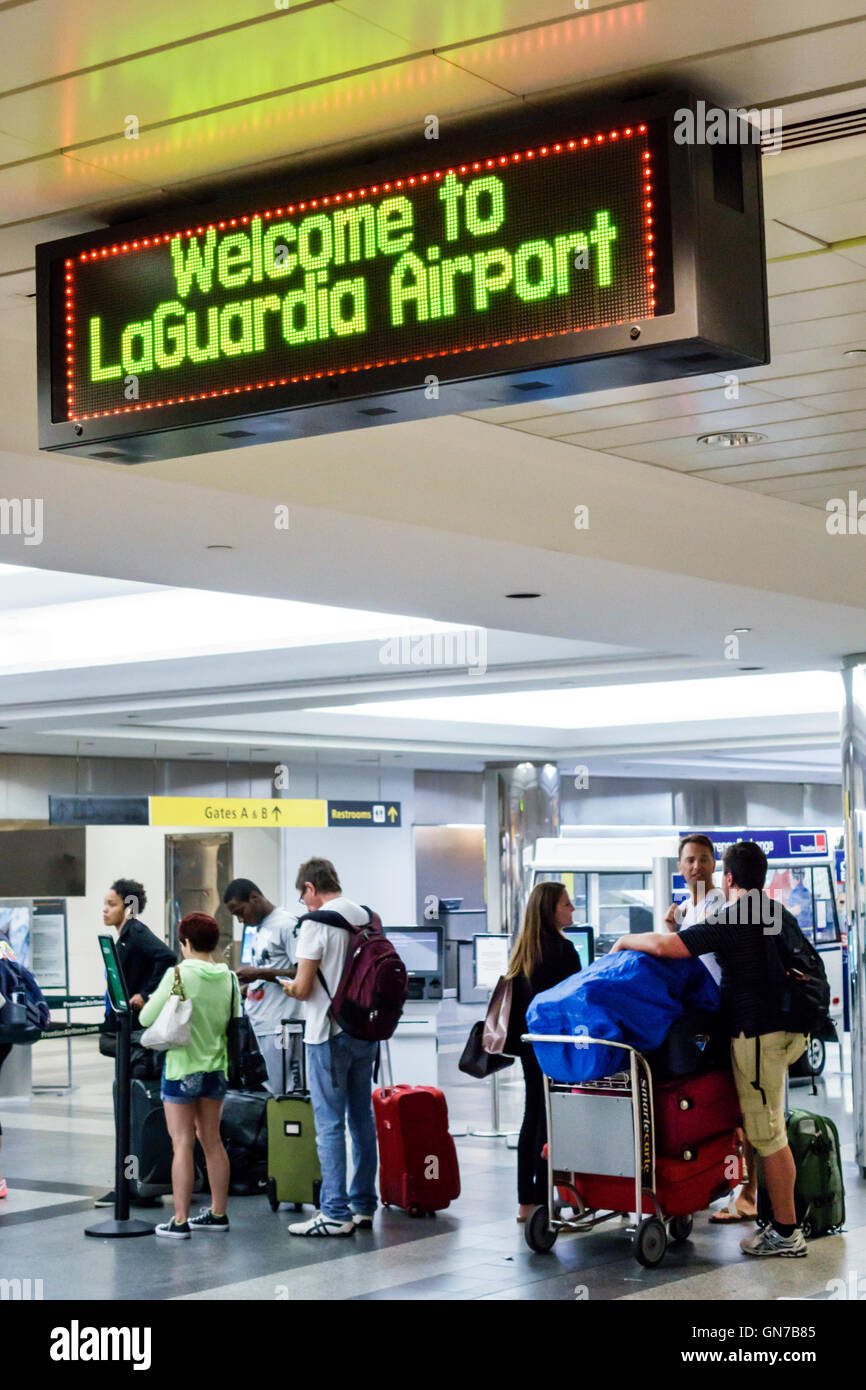 New York City,NY NYC Queens,LaGuardia Airport,LGA,domestic airport,terminal,Frontier Airlines,low-cost airline carrier,counter,check-in,Black African Stock Photo