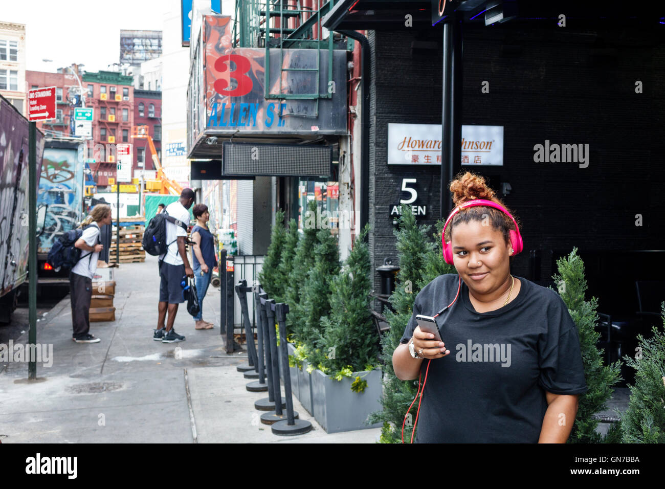 New York City,NY NYC,Lower Manhattan,Allen Street,sidewalk,Black Blacks African Africans ethnic minority,adult adults,woman women female lady,young ad Stock Photo