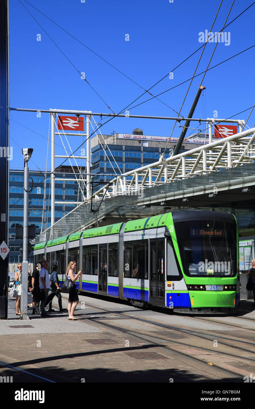 Tram in front of busy East Croydon train station, in south London, England, UK Stock Photo