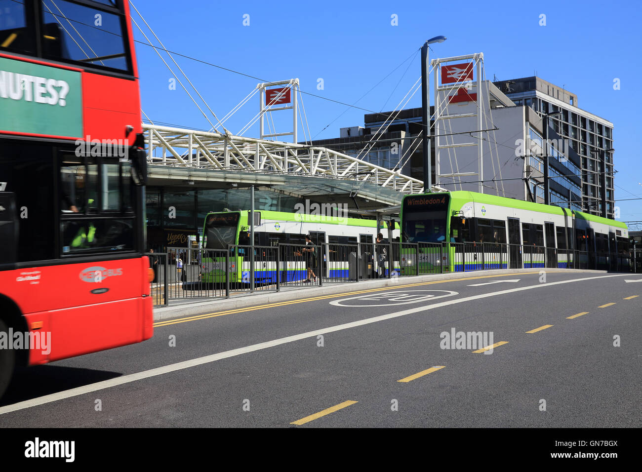 Trams and busmin front of busy East Croydon train station, in south London, England, UK Stock Photo