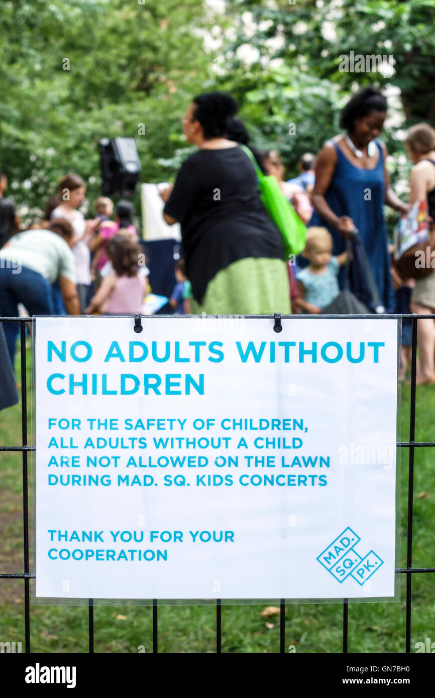 New York City,NY NYC Manhattan,Madison Square Park,Farragut Lawn,garden,concert for kids,interactive music series,sign,safety,warning,no adult without Stock Photo