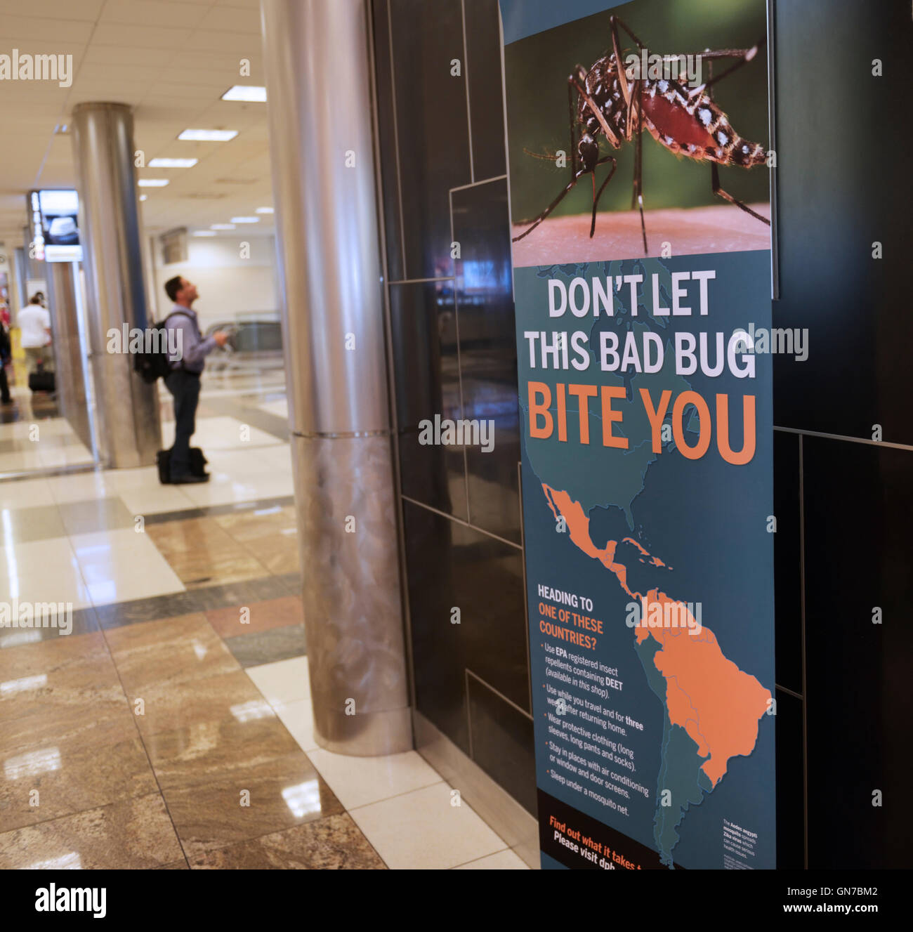 Sign in airport (Atlanta) warning travelers of the Aedes aegypti mosquito and Zika virus Stock Photo