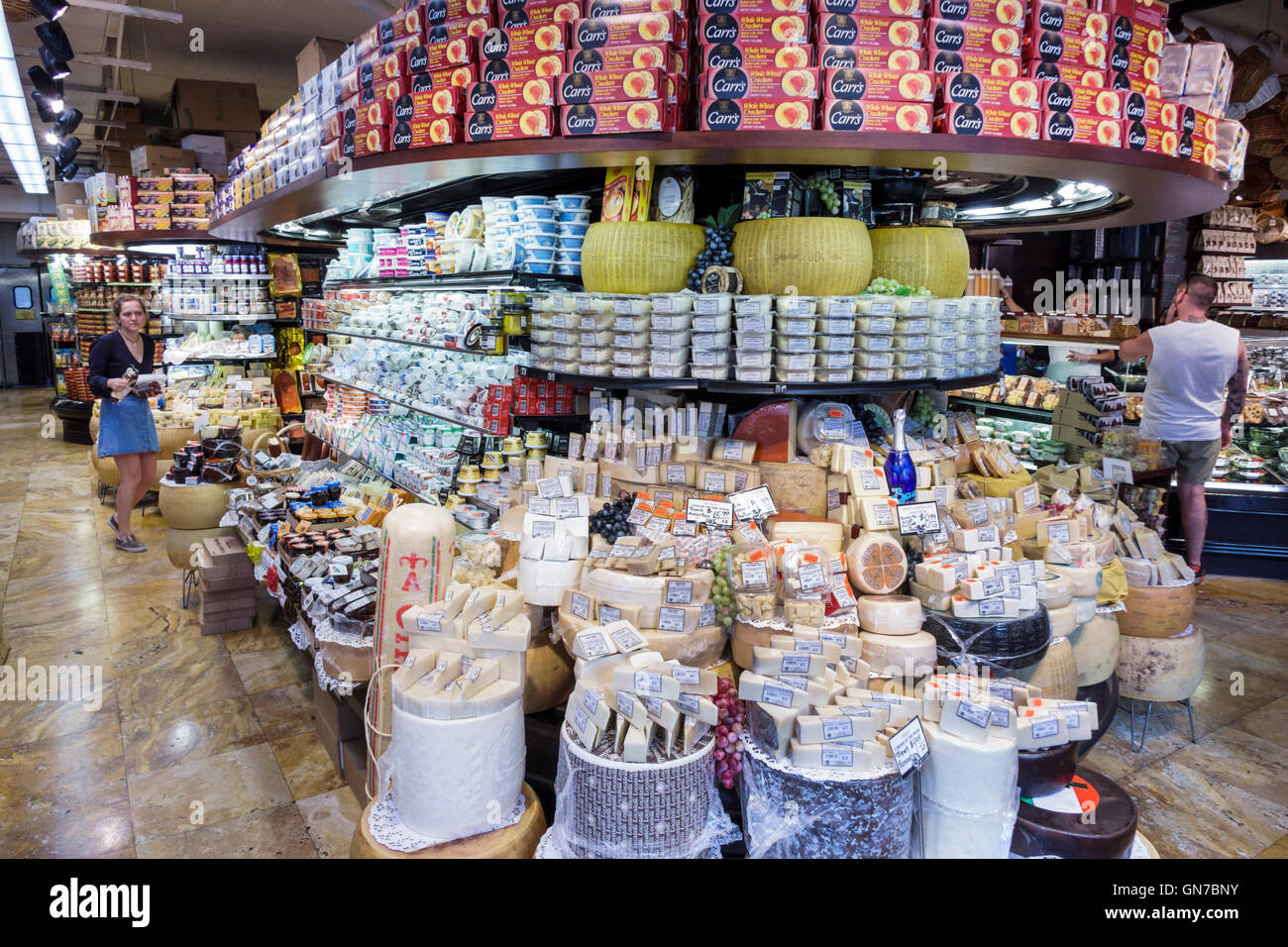 New York City,NY NYC Manhattan,Chelsea,Westside Market NYC,food market,gourmet,grocery store,cheese,cheese wheel,domestic,imported,adult adults,woman Stock Photo