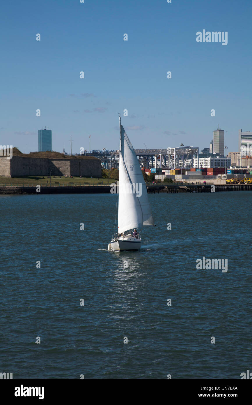 Yacht sailing by Fort Independence and Boston Waterfront from Boston Harbor Boston Massachusetts