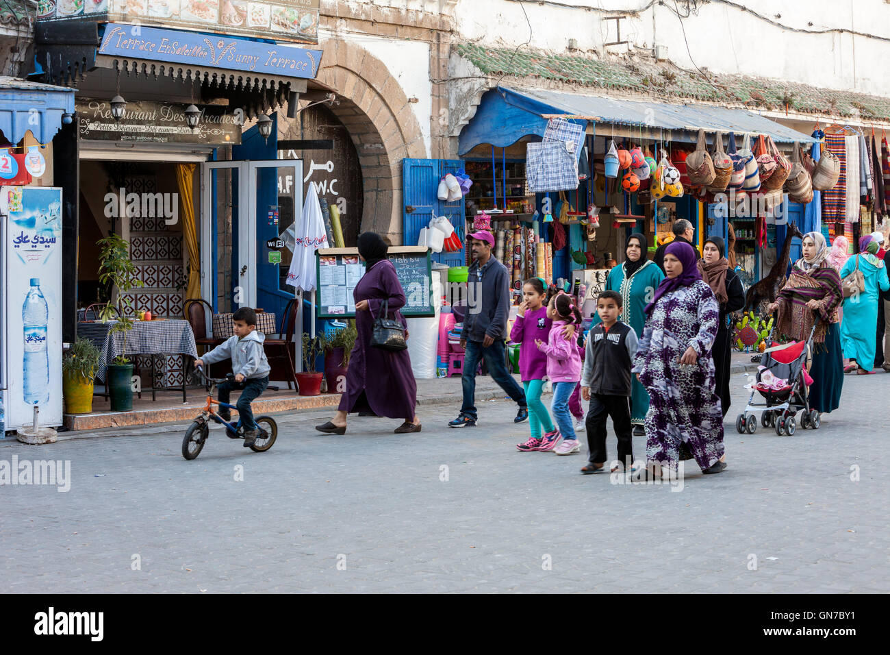 Essaouira, Morocco.  Women and Children Walking, Avenue de l'Istiqlal Street Scene. Stock Photo