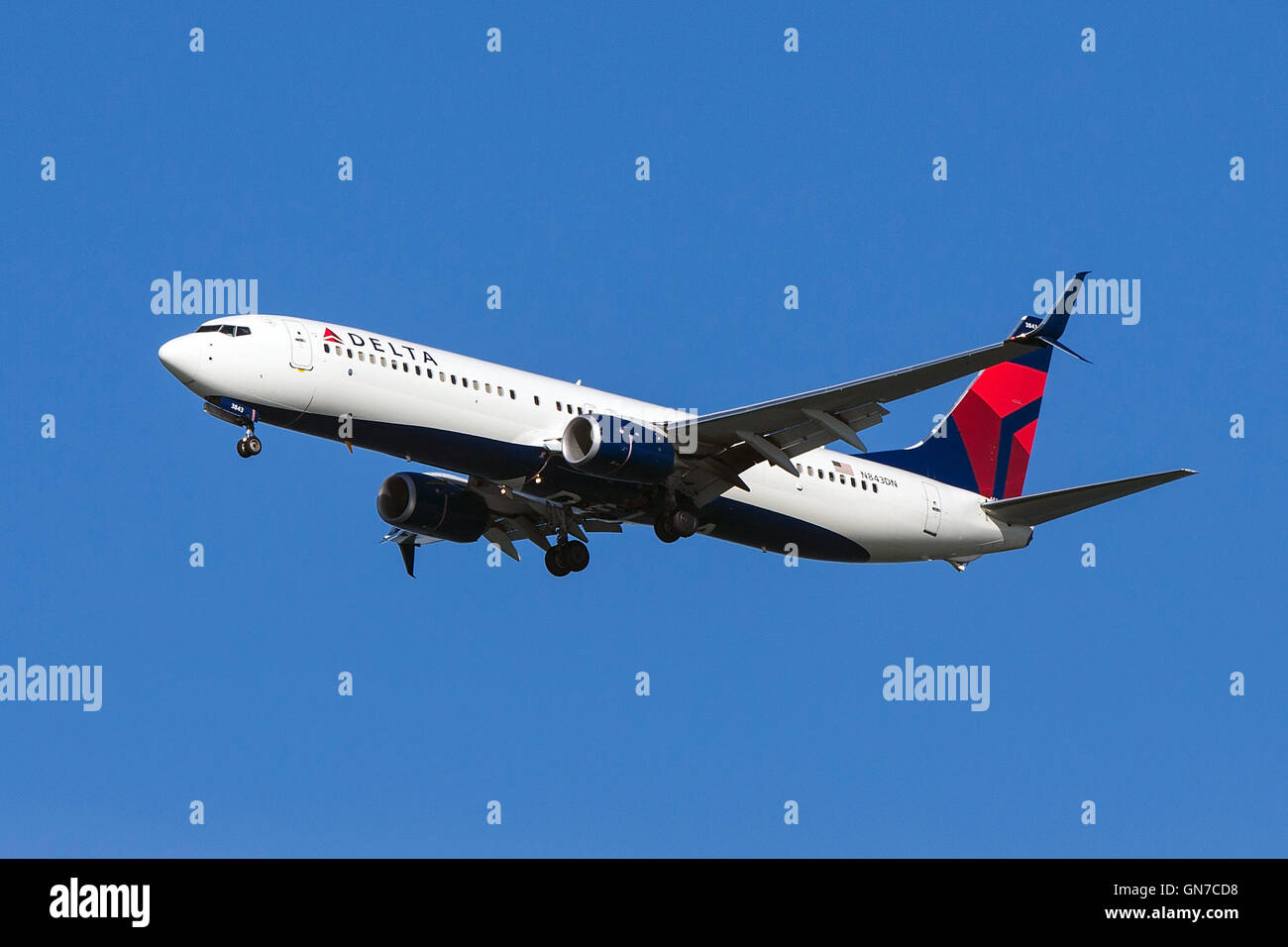Delta Airlines Boeing 737-932ER (registration N843DN) approaches San Francisco International Airport (SFO) over San Mateo, California, United States of America Stock Photo