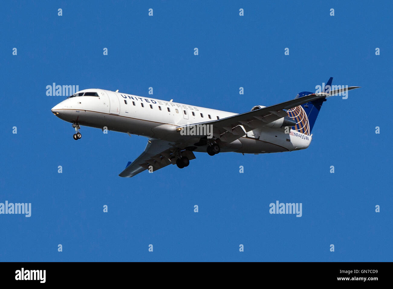 United Express Bombardier CRJ-200ER CL-600-2B19 (registration N945SW) approaches San Francisco International Airport (SFO) over San Mateo, California, United States of America Stock Photo