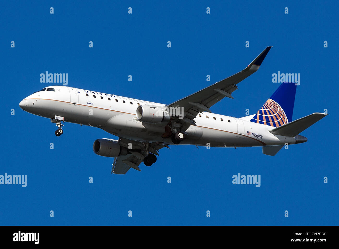 United Express Embraer ERJ170-200LR (registration N150SY) approaches San Francisco International Airport (SFO) over San Mateo, California, United States of America Stock Photo