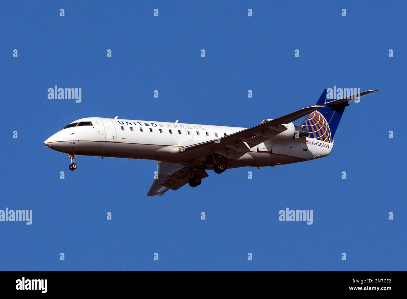 United Express Bombardier CRJ-200ER CL-600-2B19 (registration N980SW) approaches San Francisco International Airport (SFO) over San Mateo, California, United States of America Stock Photo