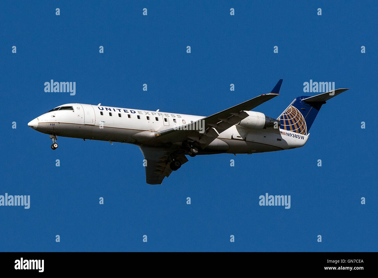 United Express Bombardier CRJ-200ER CL-600-2B19 (registration N938SW) approaches San Francisco International Airport (SFO) over San Mateo, California, United States of America Stock Photo